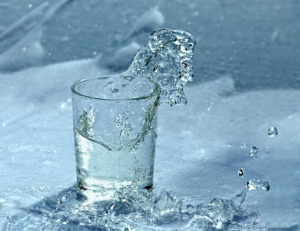 Fresh water splashing from glass